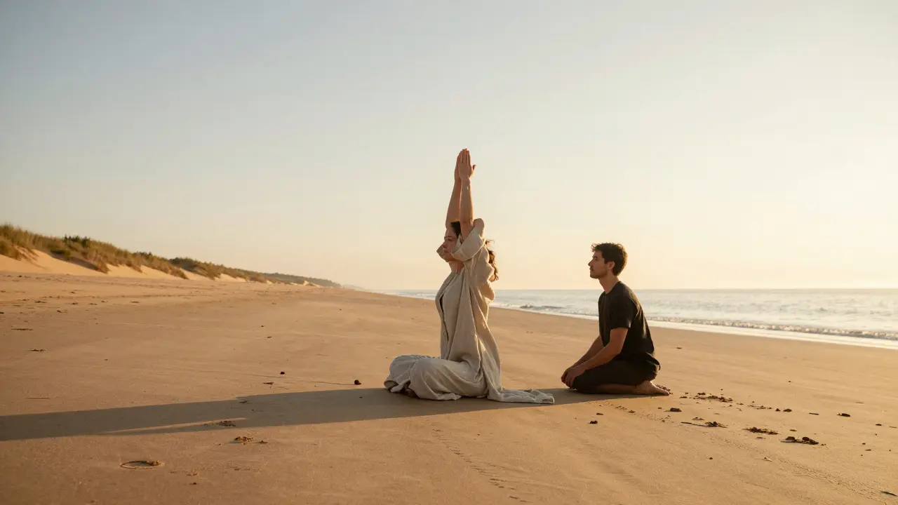 A person practices sunrise yoga on a private beach, alone, with calm sea and dunes in the background.