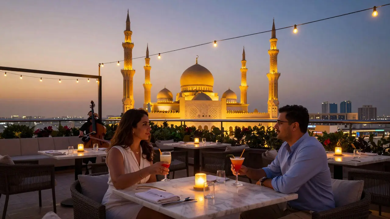Couples enjoying cocktails on a rooftop lounge with the golden dome of Sheikh Zayed Grand Mosque in the background at sunset.