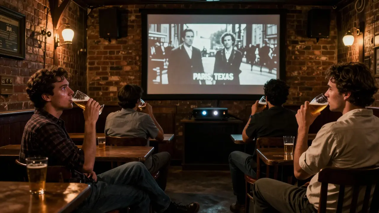 Patrons in a pub backroom silently watch a film projected on a brick wall.