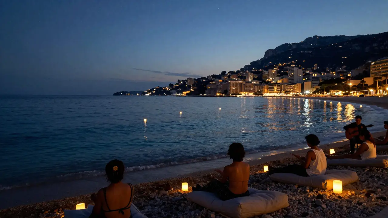 People floating lanterns above a quiet midnight beach under a starry sky with distant city lights.
